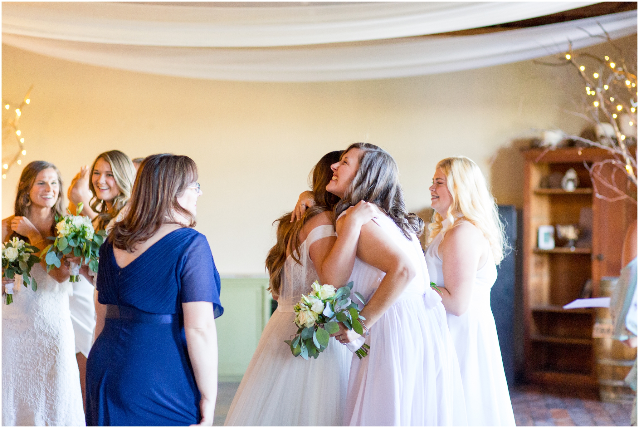 Spokane wedding photographer captured a Fontaine Estates Winery wedding at a Yakima wedding venue with mountain views and orchards. The day included white bridesmaid dresses and was photographed by Virginia Wedding Photographer Taylor Rose Photography.