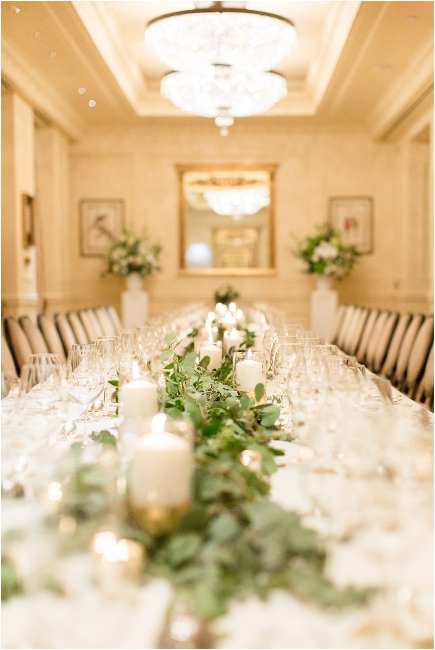 Glamorous Gatsby wedding reception with greens and gold accents